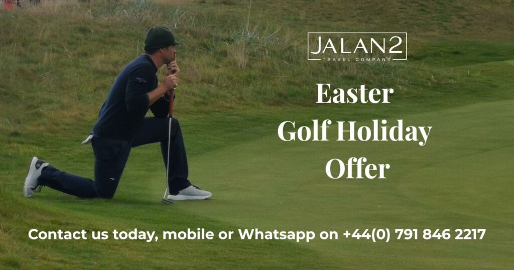 A golfer kneeling on a golf course