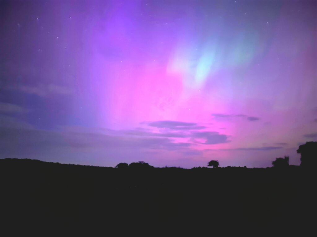 Aurora northern light in the night sky of Scotland